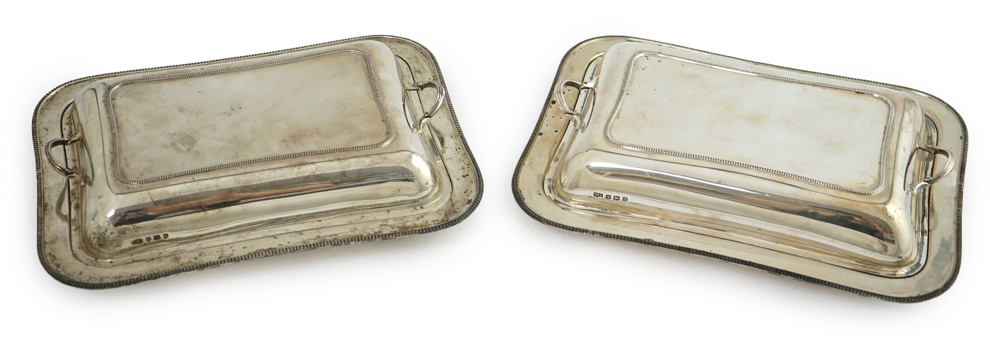 A pair of 1930's silver entrée dishes and covers, by Roberts & Belk